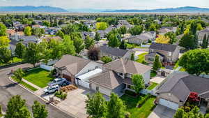 Aerial perspective of suburban area with a mountain backdrop