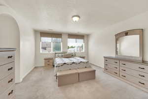 The large upstairs Master Suite offers a private retreat, featuring large windows, bringing in the natural light. There is also room for a cozy sitting area to relax and read.