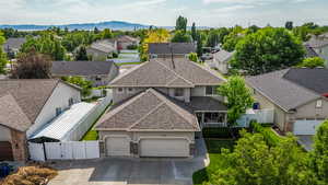 Aerial perspective of suburban area featuring a mountainous background