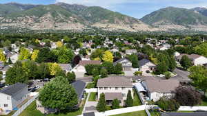 Aerial view of residential area featuring a mountain backdrop