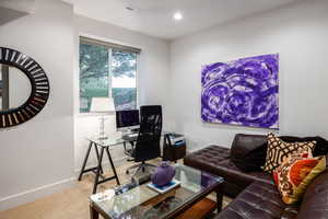 Carpeted office with baseboards and recessed lighting