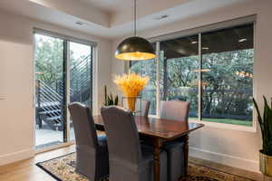 Dining space featuring baseboards and wood finished floors
