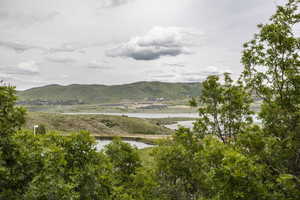 View of mountain backdrop with a large body of water