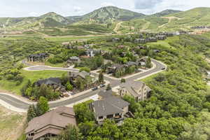 Aerial perspective of suburban area with a mountain backdrop