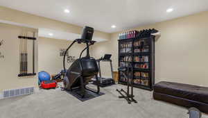 Exercise area featuring carpet floors, recessed lighting, and baseboards