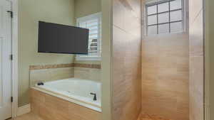 Full bath featuring a garden tub