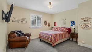 Bedroom with carpet and baseboards