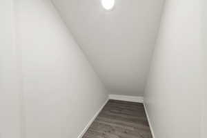 Stairs featuring baseboards and wood finished floors