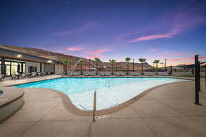 Community pool with a patio area
