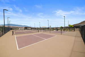 View of tennis court featuring a mountain view