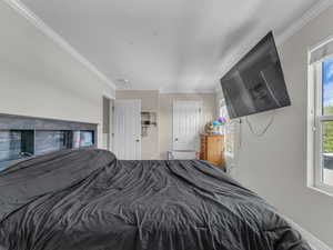 Bedroom featuring crown molding