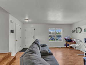 Living room featuring wood finished floors and baseboards