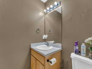 Bathroom with toilet and vanity
