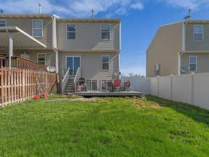 Back of house featuring a deck