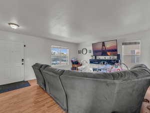 Living room featuring light wood finished floors and baseboards