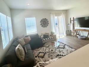 Living area with recessed lighting and wood finished floors