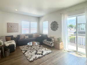 Living room featuring hardwood / wood-style floors and recessed lighting