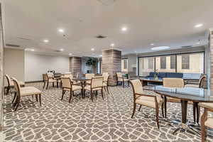 Dining area featuring ornate columns, ornamental molding, baseboards, recessed lighting, and carpet floors