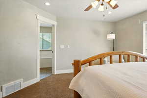 Carpeted bedroom with recessed lighting, ceiling fan, and baseboards