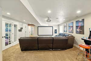 Home theater room with carpet flooring, recessed lighting, baseboards, and french doors