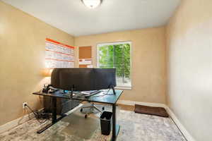 Office featuring baseboards and carpet
