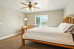 Bedroom featuring carpet flooring, baseboards, recessed lighting, and ceiling fan