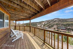 Wooden deck featuring a mountain view