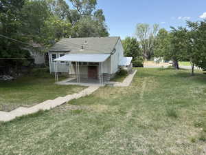 View of green lawn with entry steps