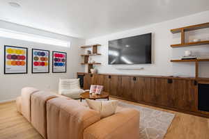 Living area with light wood-style flooring