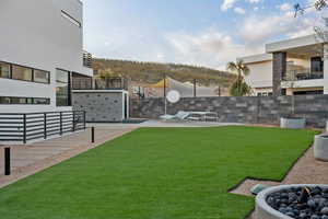 View of yard with a patio area and a fire pit