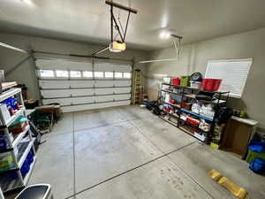 Garage featuring a garage door opener