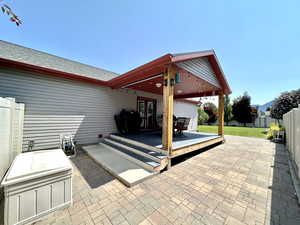 View of patio featuring french doors and a wooden deck