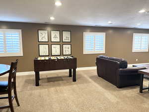 Game room with carpet flooring, recessed lighting, and baseboards