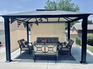 View of patio / terrace with outdoor lounge area and a gazebo