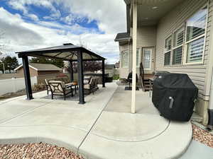 View of patio / terrace featuring an outdoor living space, a gazebo, and grilling area