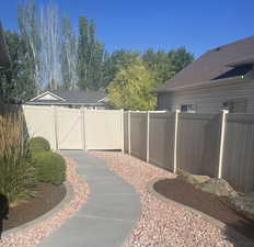 View of yard with a gate