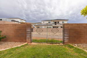 Backyard gate with direct access to walking trail.
