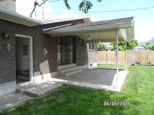 View of patio with entry steps and a mountain view