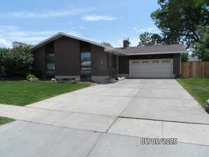 3 Bed 2 Bath Rambler featuring brick siding and attached 2 car garage