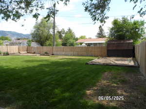 View of yard and shed