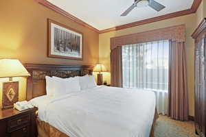 Bedroom featuring crown molding and ceiling fan
