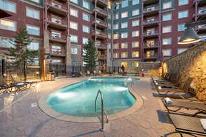 Community pool featuring a patio area