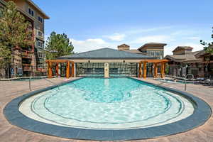 Community pool featuring a gazebo and a patio area