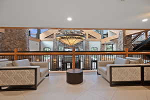 Common area with a towering ceiling and recessed lighting
