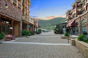 View of decorative road featuring a mountain view and street lighting