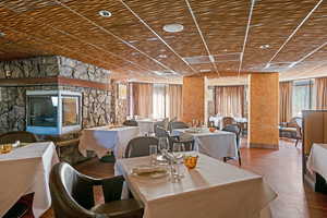 Dining area featuring wood finished floors, wooden ceiling, and recessed lighting