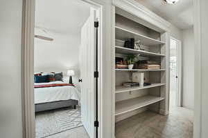 Bedroom with carpet floors, a textured ceiling, and baseboards
