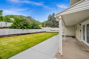 View of yard with a patio and a mountain view