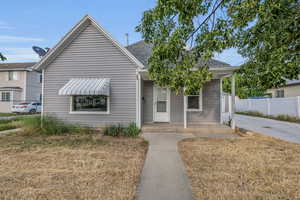 Bungalow-style house with covered porch and roof with shingles