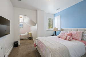 Bedroom with carpet and baseboards